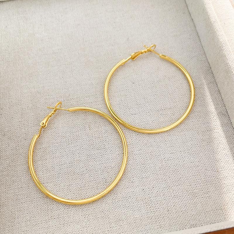Round hoop earrings 810056657479 - COCOMELODY
